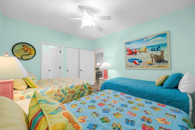 bedroom with ceiling fan and wood finished floors