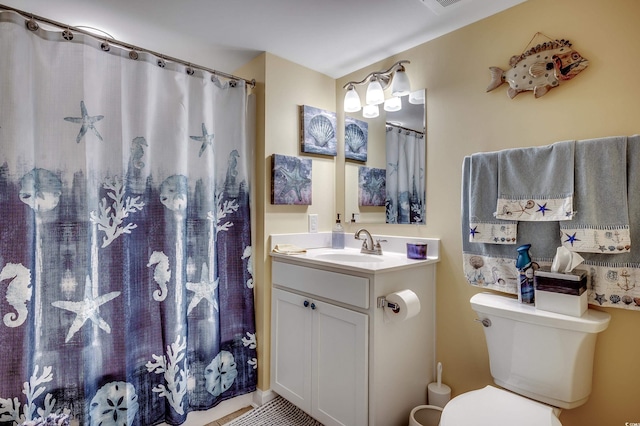 bathroom featuring vanity, curtained shower, toilet, and visible vents