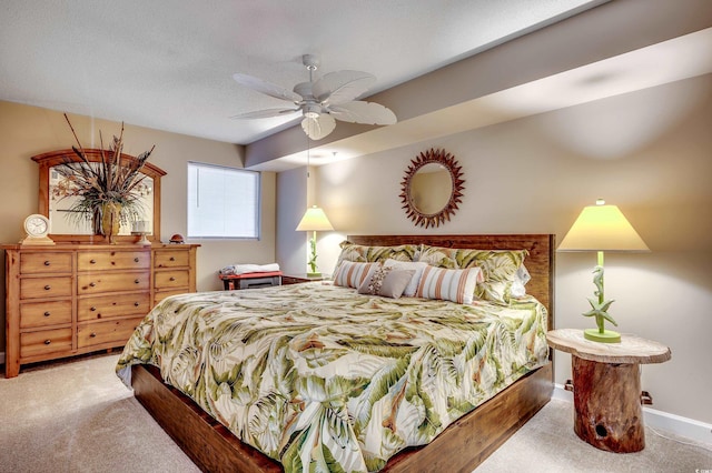 bedroom with baseboards, carpet floors, a textured ceiling, and ceiling fan