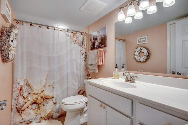 bathroom with visible vents, curtained shower, toilet, and vanity