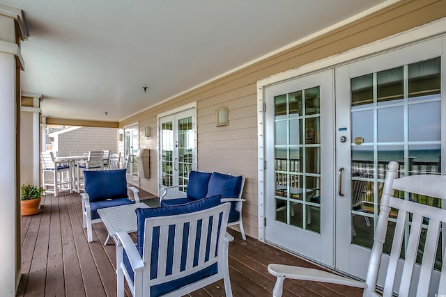 deck with french doors and an outdoor hangout area