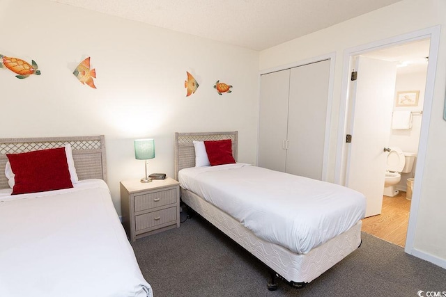 bedroom featuring wood finished floors and a closet