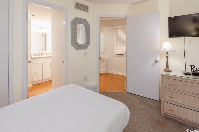 bedroom featuring connected bathroom