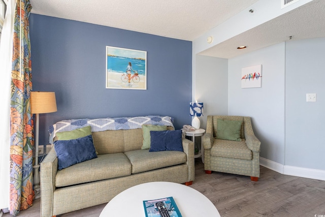 161 Seawatch Dr Unit 808, Myrtle Beach, SC 29572 - living room with baseboards, a textured ceiling, and wood finished floors