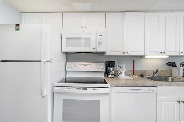 161 Seawatch Dr Unit 808, Myrtle Beach, SC 29572 - kitchen featuring white appliances, white cabinets, and light countertops