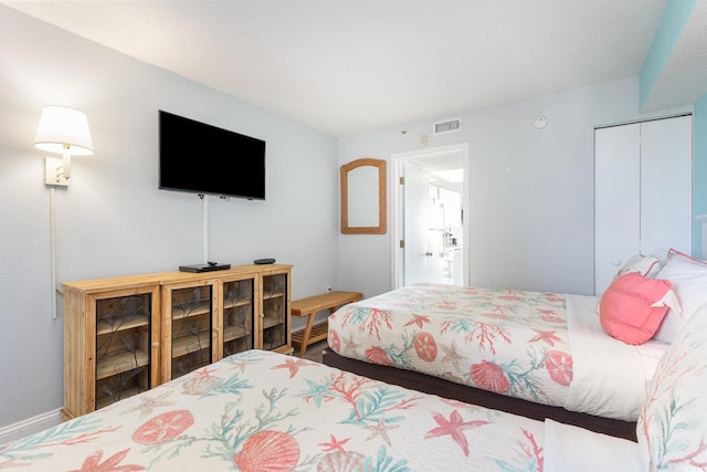 161 Seawatch Dr Unit 808, Myrtle Beach, SC 29572 - bedroom with a closet, baseboards, and visible vents
