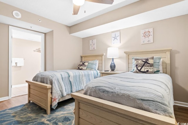 bedroom with ceiling fan, baseboards, and wood finished floors