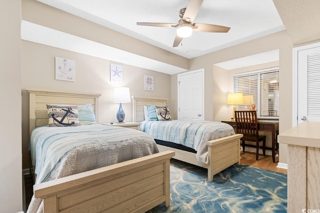 bedroom featuring dark wood finished floors and a ceiling fan