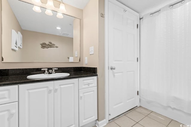 bathroom with vanity and tile patterned flooring