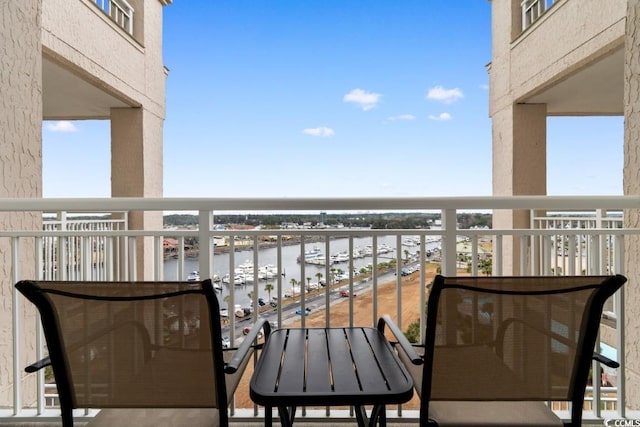 balcony featuring a water view