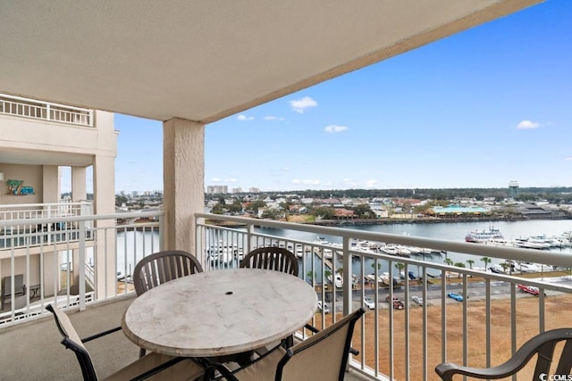 balcony featuring a water view