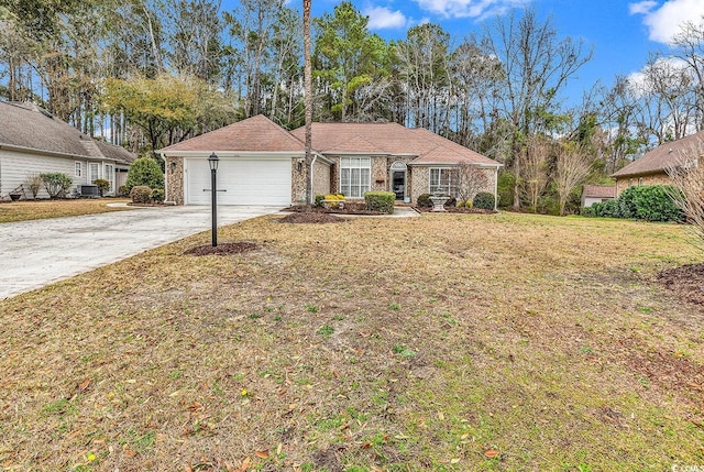 ranch-style house with a front lawn, central AC, a garage, and driveway