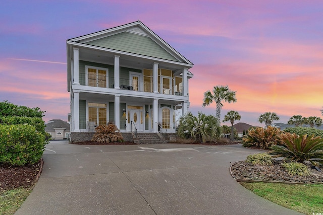 view of front of house featuring a balcony and a porch