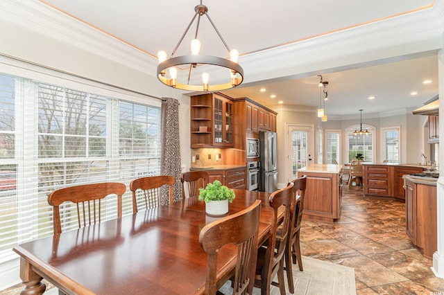 dining room featuring a chandelier, recessed lighting, a wealth of natural light, and ornamental molding