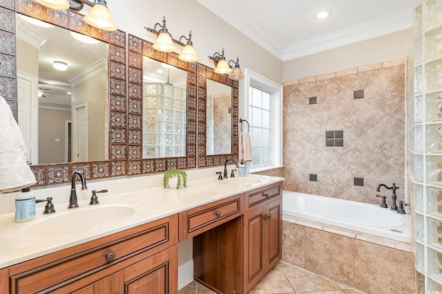 bathroom featuring tiled bath, tile patterned floors, crown molding, and a sink