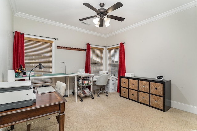 office with visible vents, baseboards, carpet floors, ornamental molding, and a ceiling fan