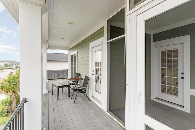 wooden deck featuring covered porch