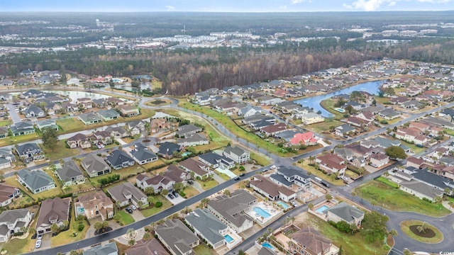 drone / aerial view with a residential view and a water view