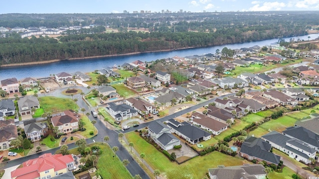 birds eye view of property with a residential view and a water view