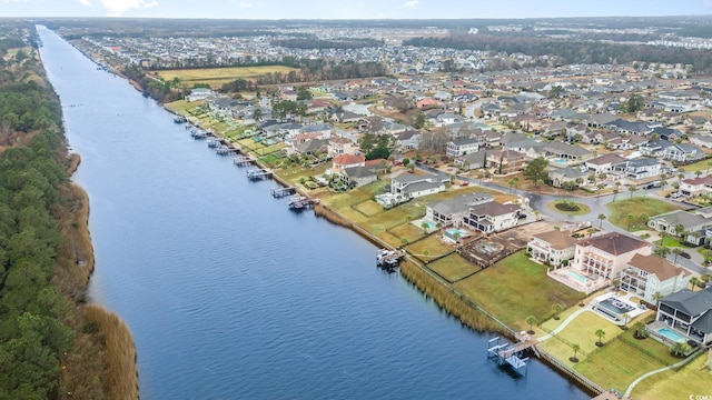 bird's eye view featuring a residential view and a water view