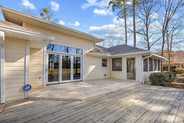 wooden terrace with a patio