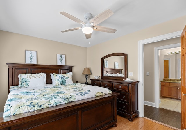 bedroom featuring light wood finished floors, baseboards, and a ceiling fan