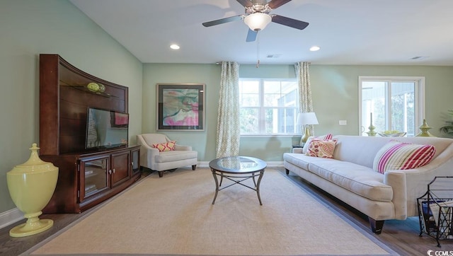 living area featuring baseboards, ceiling fan, recessed lighting, and wood finished floors