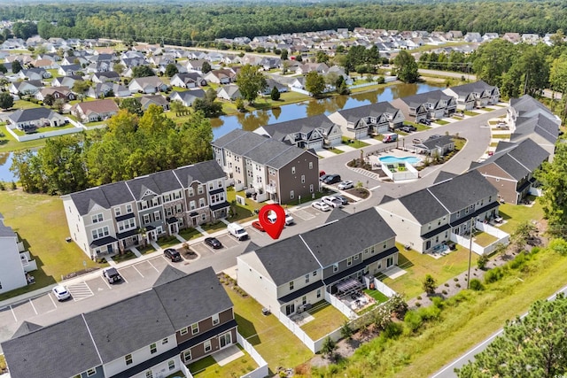 bird's eye view with a residential view and a water view