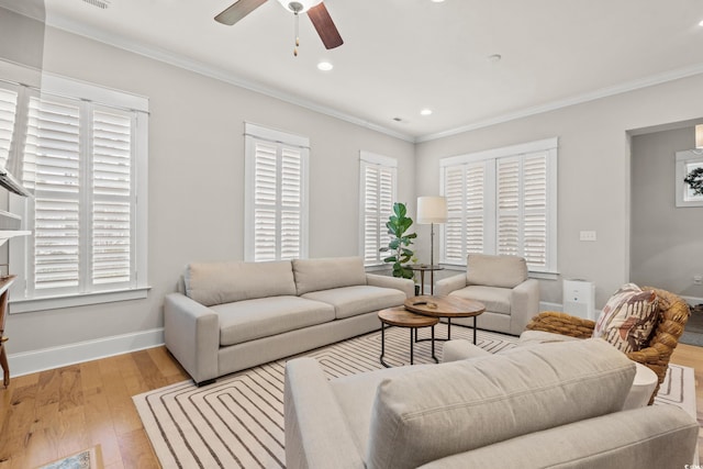 living area featuring recessed lighting, light wood-type flooring, baseboards, and ornamental molding