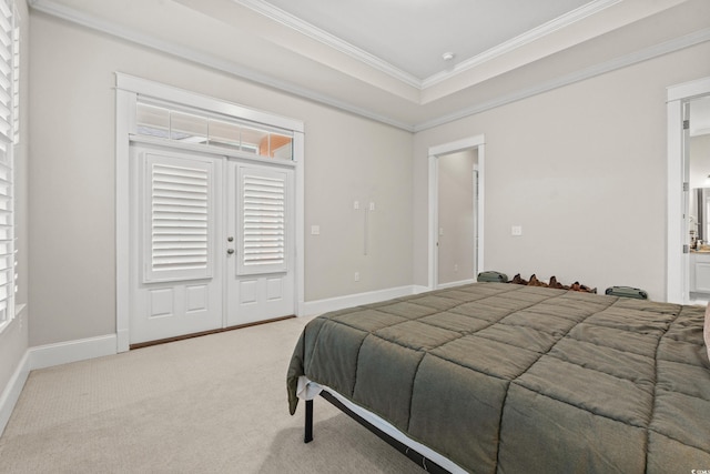 bedroom with a raised ceiling, carpet flooring, baseboards, and ornamental molding