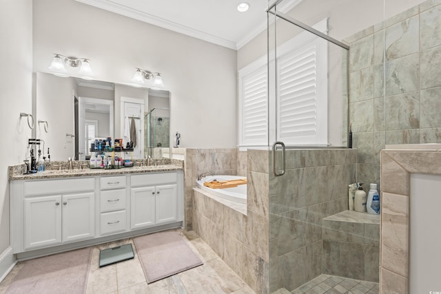 bathroom with a garden tub, a sink, a shower stall, crown molding, and double vanity