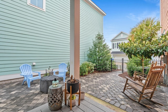 view of patio featuring fence