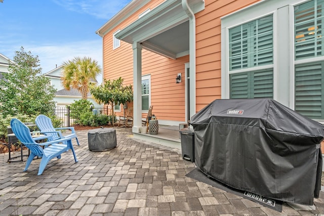 view of patio / terrace with area for grilling and fence