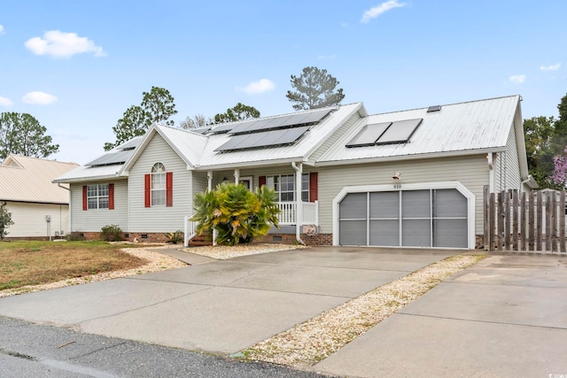 ranch-style home featuring crawl space, covered porch, driveway, and metal roof