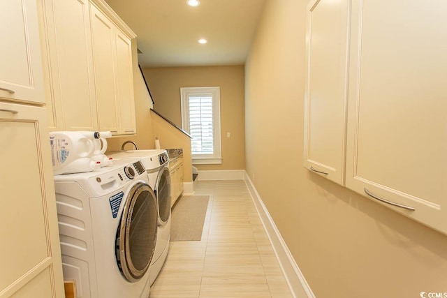 laundry room with light tile patterned floors, baseboards, recessed lighting, cabinet space, and washer and dryer