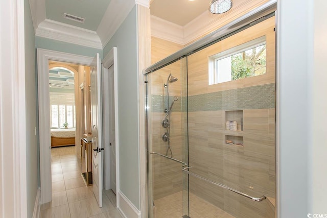 ensuite bathroom with visible vents, a stall shower, ornamental molding, tile patterned floors, and connected bathroom