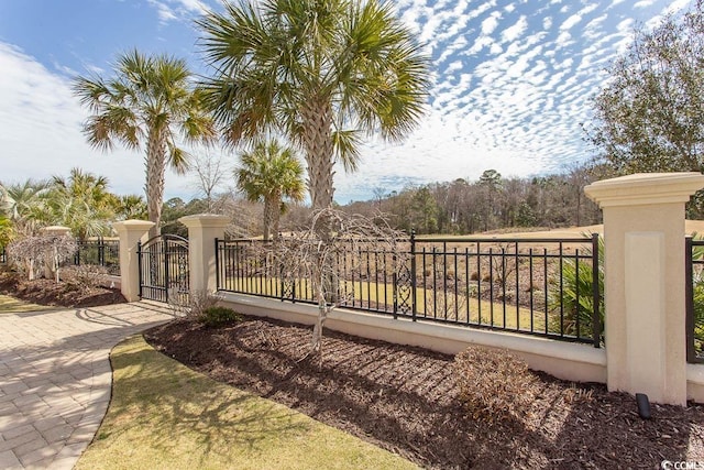 view of gate featuring a fenced front yard