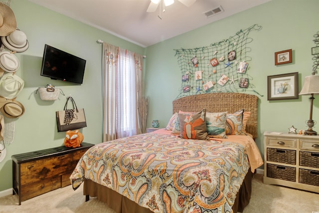 carpeted bedroom featuring visible vents, a ceiling fan, and vaulted ceiling