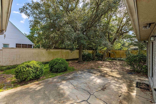 409 65th Ave N, Myrtle Beach, SC 29572 - fenced backyard featuring a patio