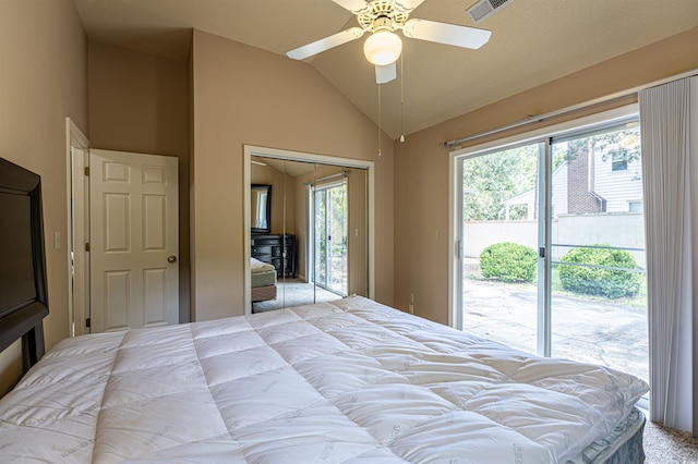 bedroom featuring multiple windows, lofted ceiling, visible vents, and access to outside