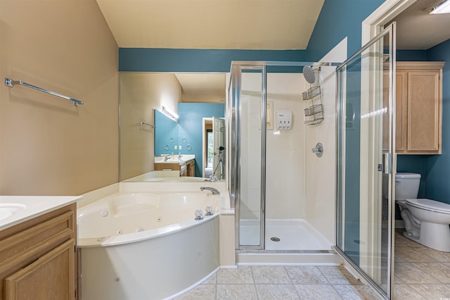 full bath featuring vanity, a stall shower, tile patterned flooring, a jetted tub, and toilet