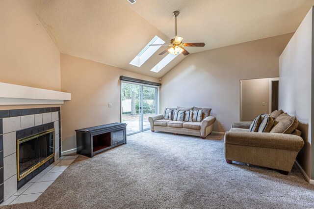 409 65th Ave N, Myrtle Beach, SC 29572 - living area with a fireplace, a skylight, a ceiling fan, light colored carpet, and high vaulted ceiling