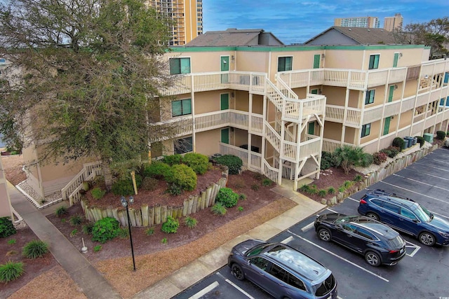 view of property with uncovered parking