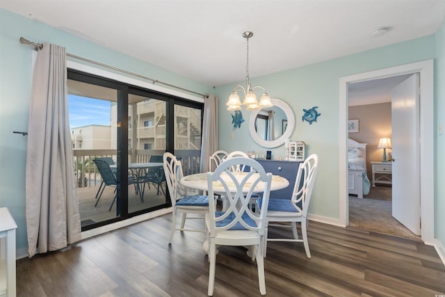 9661 Shore Dr Unit A-21, Myrtle Beach, SC 29572 - dining room featuring a chandelier, wood finished floors, and baseboards
