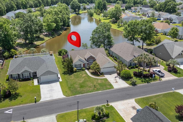 aerial view featuring a residential view and a water view