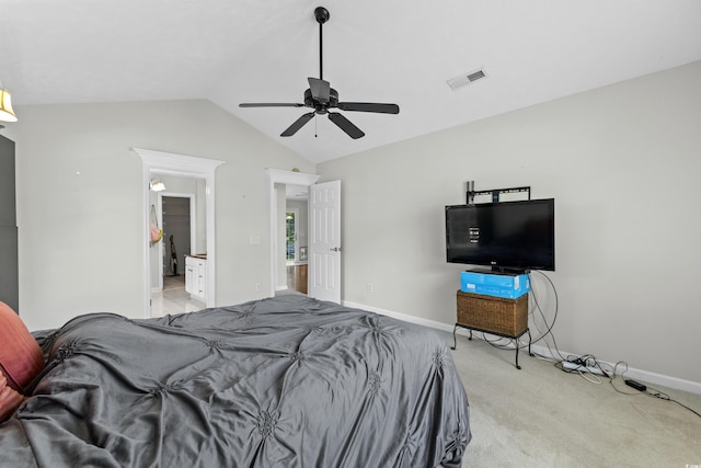 bedroom featuring vaulted ceiling, baseboards, visible vents, and light carpet