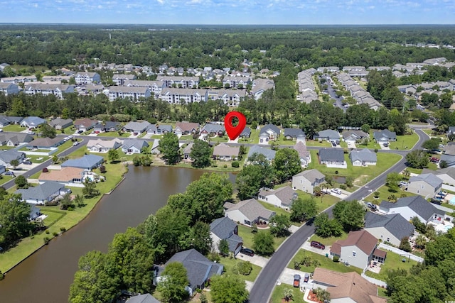 bird's eye view featuring a residential view and a water view