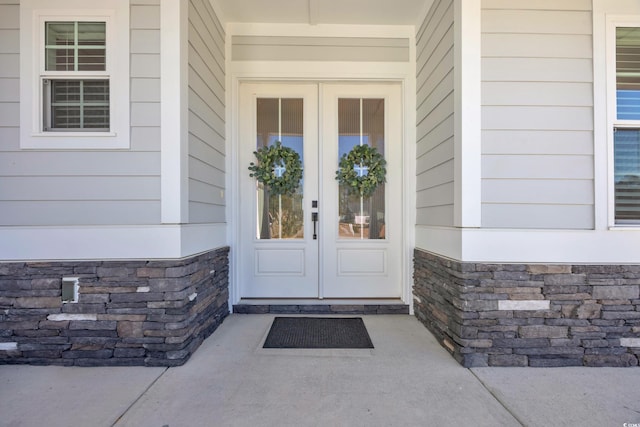 view of exterior entry featuring french doors