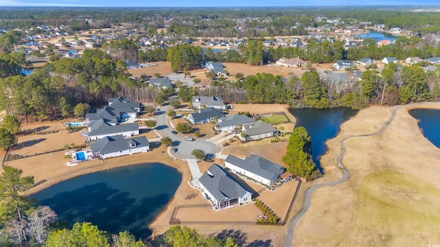 birds eye view of property featuring a water view and a residential view