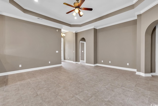 empty room featuring baseboards, arched walkways, a raised ceiling, and ceiling fan with notable chandelier